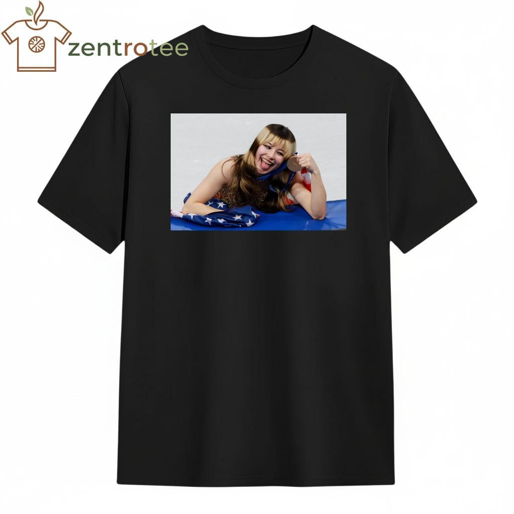 Alysa Liu stick out tongue with gold medal shirt