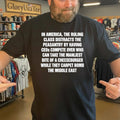In America, The Ruling Class Distracts The Peasantry By Having CEOs Compete Over Who Can Take The Manliest Bite Of A Cheeseburger While They Carpet Bomb The Middle East Shirt